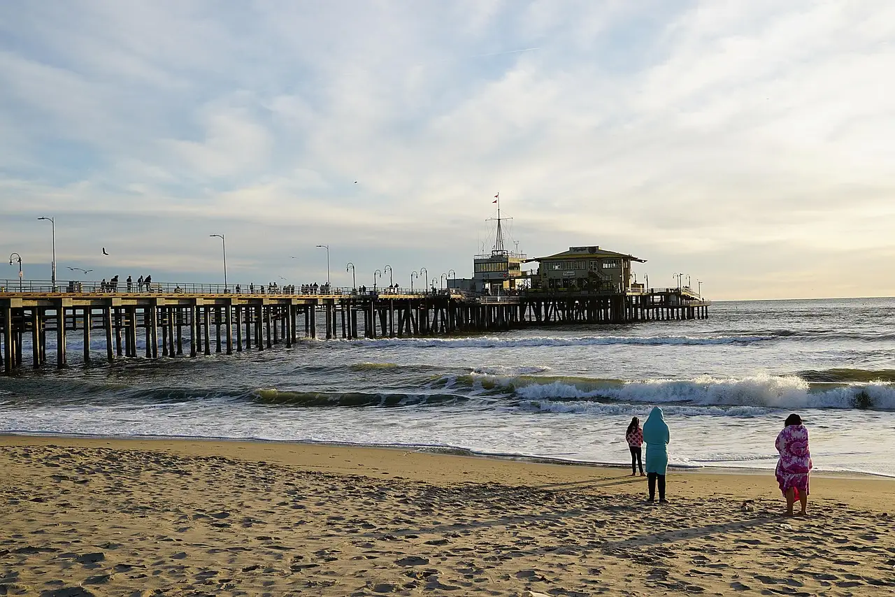 Santa Monica beach and pier on a mild day with light clouds