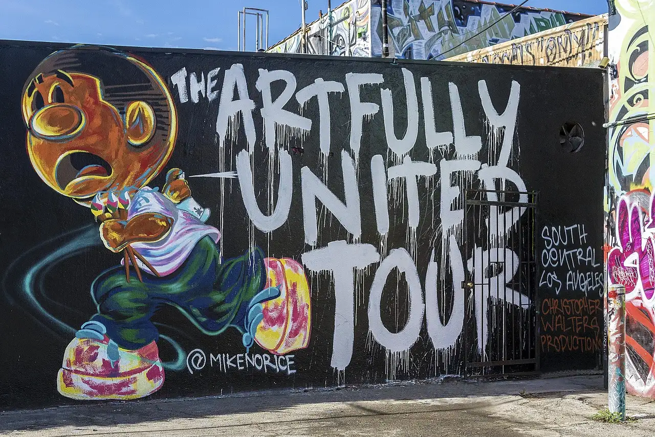 A large painted street art mural on a Los Angeles wall