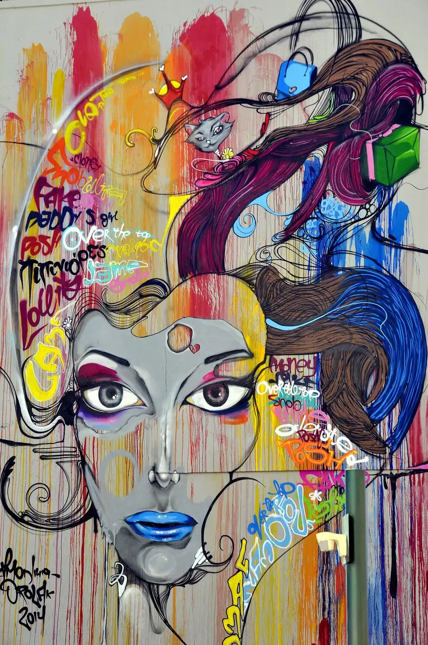 A colourful painted mural of a woman's face on a wall