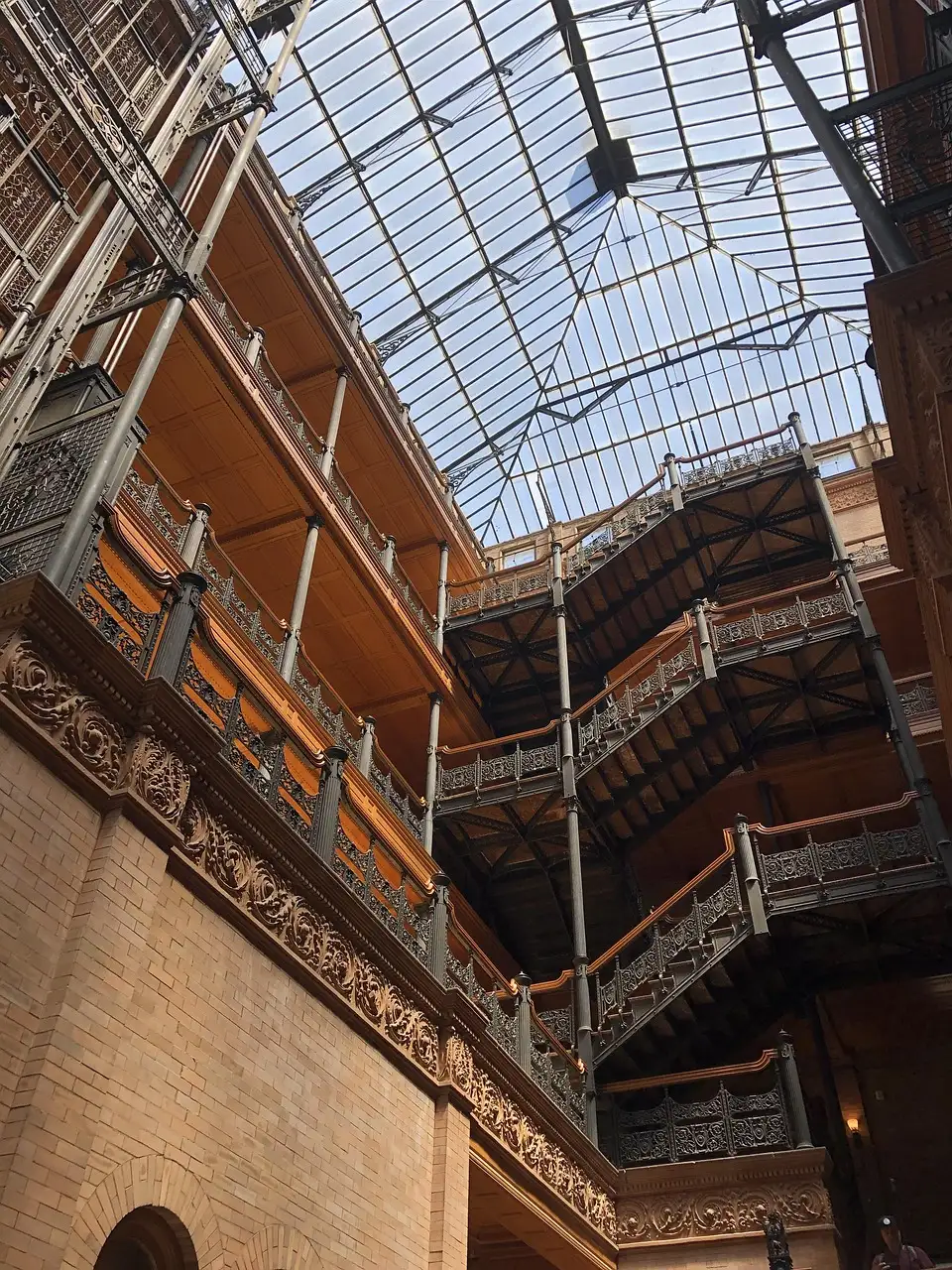 Wrought-iron balconies and stairs under the glass roof of the Bradbury Building