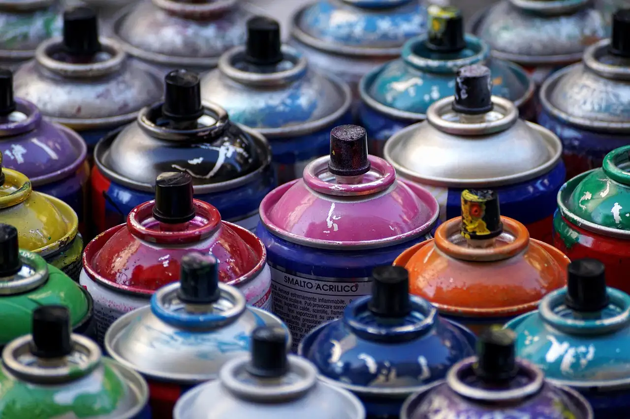 Rows of colourful spray paint cans