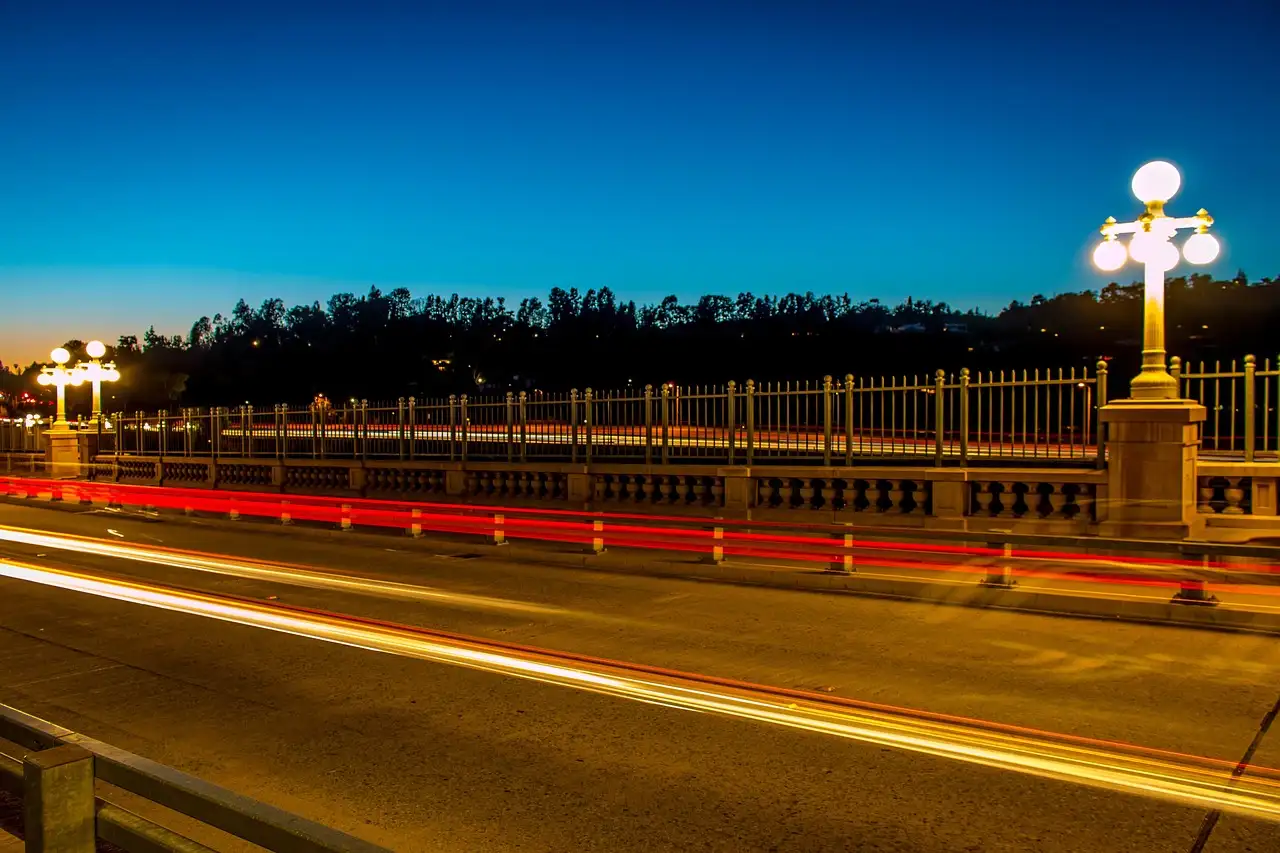 The Colorado Street Bridge in Pasadena at dusk, with light trails from passing cars