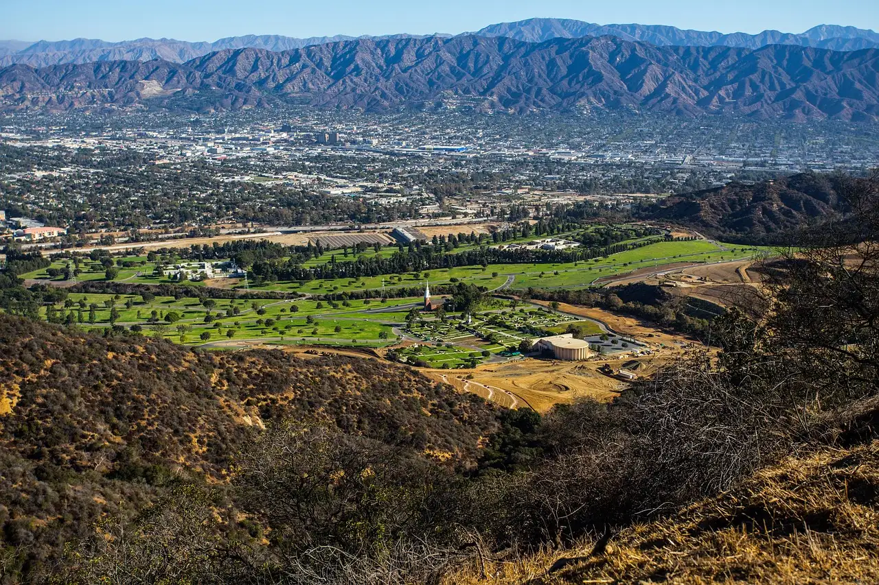 View from the Griffith Park hills over green valleys to the mountains