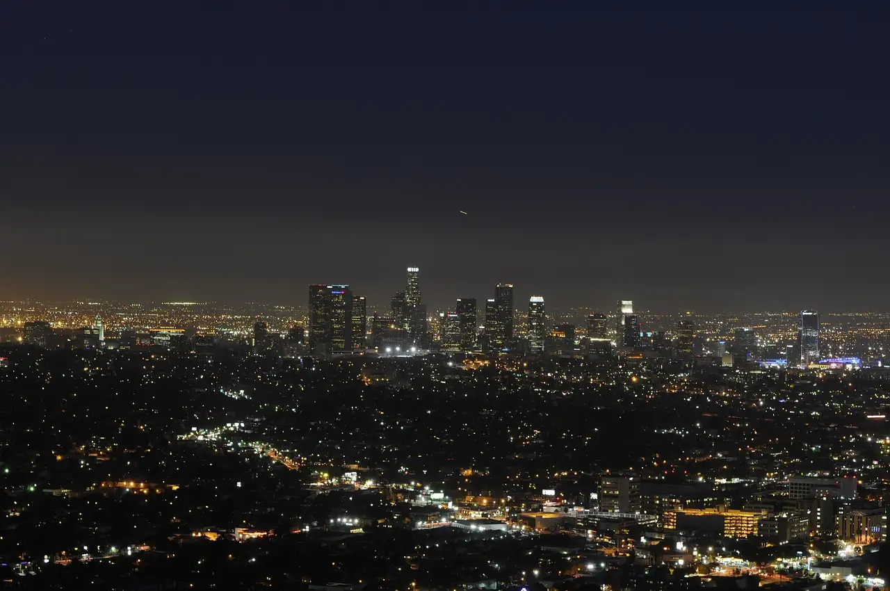 The lights of Los Angeles spread out below the hills at night