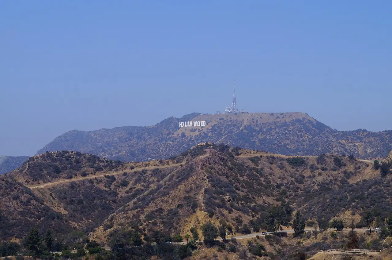 The dry hills of Griffith Park, with the Hollywood Sign small on Mount Lee far behind