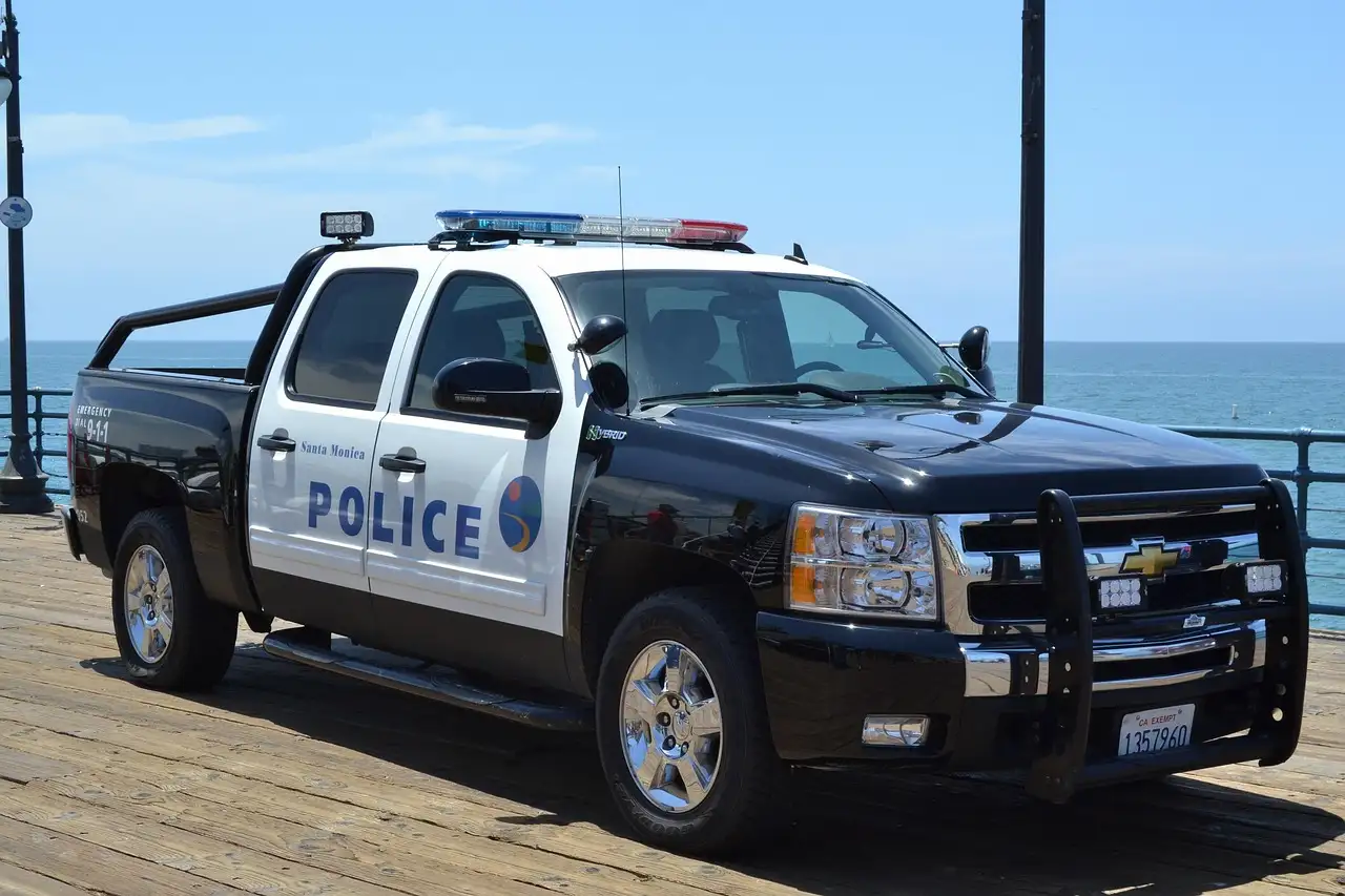 Police pickup truck parked on the Santa Monica Pier by the ocean