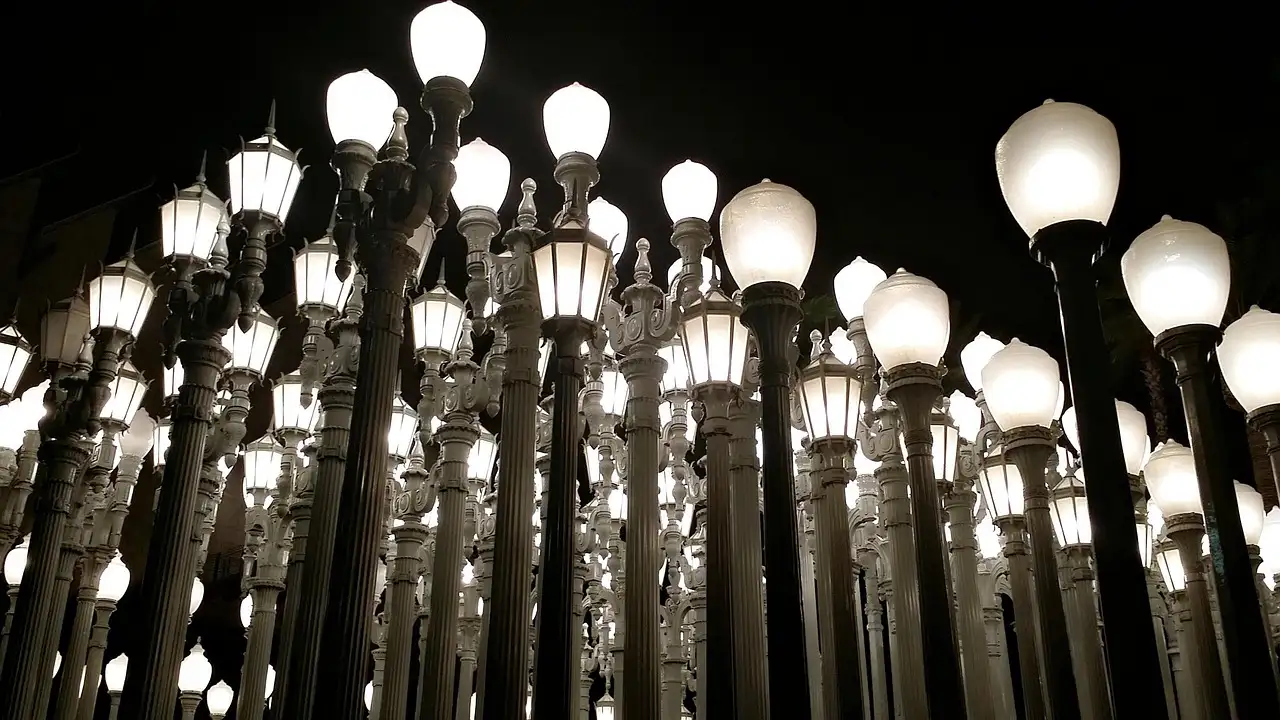 The lamps of LACMA's Urban Light glowing against a night sky