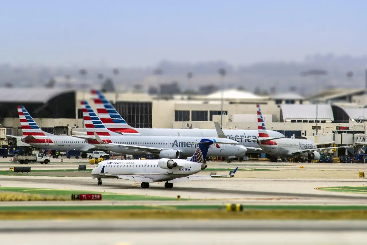 Planes parked at the terminals of Los Angeles International Airport (LAX) beside the runway