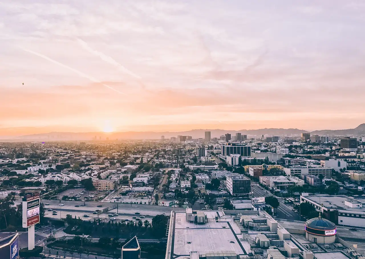 Rooftops of Los Angeles stretching to the hills at sunset