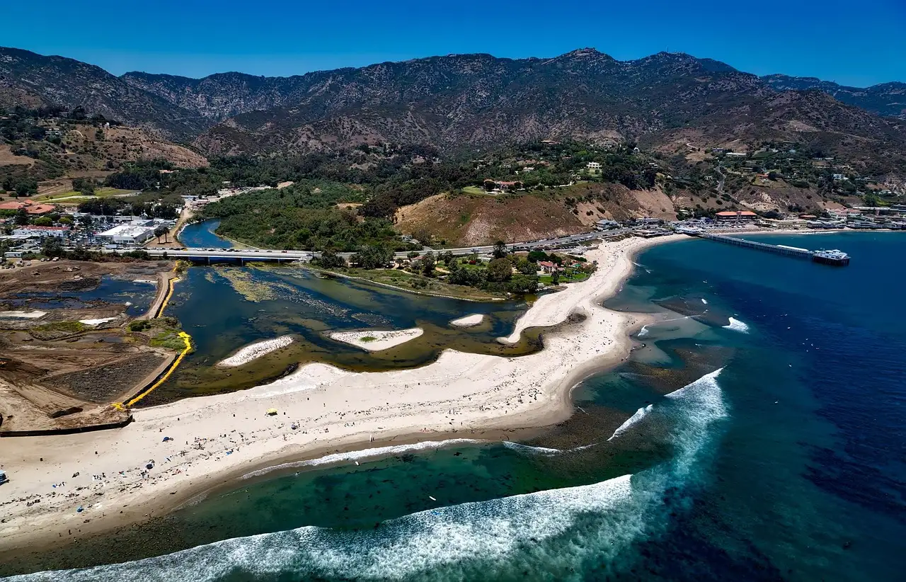 Malibu Lagoon, Surfrider Beach and Malibu Pier from the air, with mountains behind